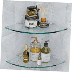 two glass shelves with bottles and soaps on them