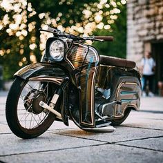 a motorcycle parked on the side of a street