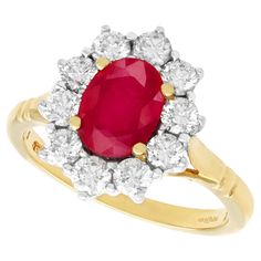 A fine and impressive vintage 1.88 carat natural ruby and 0.70 carat diamond, 18k yellow gold, 18k white gold set cluster ring; part of our vintage jewelry and estate jewelry collections. This impressive vintage ruby ring has been crafted in 18k yellow gold with a 18k white gold setting. The pierced decorated boat style setting displays a feature 1.88Ct oval mixed cut ruby set in subtle relief within four 18k yellow gold claws / prongs encircled by ten modern brilliant round cut, white gold set Vintage Ruby Ring, Boat Style, Ruby Ring Vintage, White Gold Set, 18k Yellow Gold Ring, Dress Rings, Diamond Cluster Ring, Ruby Ring, Natural Ruby