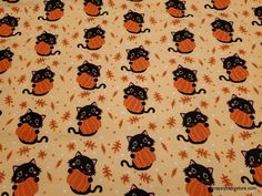 an orange and black cat pattern on a yellow background