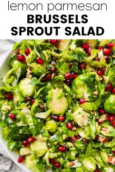 a white bowl filled with brussel sprouts and pomegranate