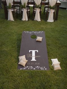 a cornhole game set up for a wedding reception