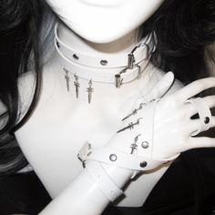 This double-wrap choker is a statement piece that adds an edgy flair to any outfit. The choker features stud embellishments and a distinctive sword pendant, creating a bold and unique look.  Please note that the price includes one choker only. Edgy Metal Choker For Cosplay, Edgy Silver Choker For Cosplay, Adjustable Metal Choker For Cosplay, Grunge Choker For Cosplay, Alternative Metal Choker For Cosplay, Edgy Choker For Alternative Fashion, Adjustable Punk Choker For Alternative Fashion, Adjustable Punk Choker For Cosplay, Adjustable Punk Style Choker For Cosplay