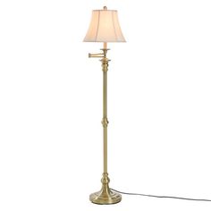 a floor lamp with a white shade on it and a cord attached to the base