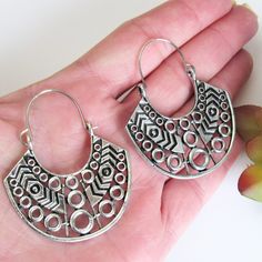 These super cute silver Geometric Ethnic Hoop Earrings are a perfect addition to your Boho wardrobe. I love the size of these! Not too big, not too small with tons of artistic interest. They are very sturdy brass earrings, but lightweight and comfortable. These make amazing gifts under $15 and are perfect for girls of all ages. Materials: Silver Brass Hoop (1 3/4in. W x 2 in. L) Visit our other BOHO EARRINGS here: https://www.etsy.com/shop/ZenJeweled?ref=seller-platform-mcnav&section_id=27786238 Handmade Silver Metal Hoop Earrings, Silver Hippie Dangle Jewelry, Hippie Silver Dangle Jewelry, Bohemian Small Hoop Nickel-free Earrings, Bohemian Small Hoop Earrings Nickel Free, Bohemian Small Hoop Earrings, Nickel Free, Metal Bohemian Hoop Earrings, Bohemian Sterling Silver Hoop Earrings For Festivals, Silver Bohemian Hoop Earrings For Festivals