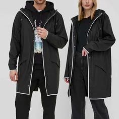 Unisex And Oversized Rains Jacket. Uninsulated, Made Of Solid Material. - Straight Fit. - Non-Detachable Drawstring Hood. - High Collar. - Fastened Outer Slip Pockets. - Reflective Elements Increase Visibility And Safety After Dark. - Snap Fastening. - Stretch Fabric. - Fine Fabric. Composition: Basic Material: 100% Polyester Coverage: 100% Pu Black Raincoat With Pockets, Black Long-sleeve Raincoat With Pockets, Black Long Sleeve Raincoat With Pockets, Black Oversized Long Sleeve Raincoat, Oversized Black Raincoat With Long Sleeves, Modern Black Winter Raincoat, Modern Long Sleeve Raincoat For Spring, Modern Black Spring Outerwear, Oversized Black Casual Raincoat