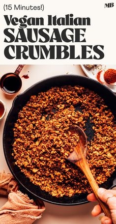 a person holding a wooden spoon over a skillet filled with sausage crumbles