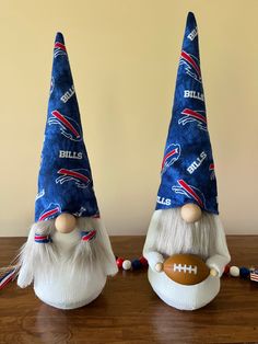 two nfl gnomes are sitting on a table