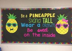 a bulletin board with two pineapples on it, and the words be a pineapple stand tall wear a crown be sweet on the inside