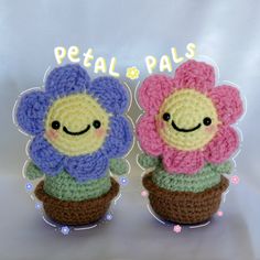 two crocheted flowers with faces on them