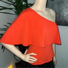 Guess By Marciano Tangerine Orange One-Shoulder Cape Sleeve Party/Cocktail Top. Size Medium. Lying Flat, From Underarm To Underarm It’s 17 Inches Across. Stretchy Fabric. Total Length Is 20.5 Inches. New With Tags/Not Previously Worn. The Interior Label Is Partially Cut But It’s Otherwise Flawless. I Purchased This For Myself But Never Wore It & Can’t Return It. $130 Comparable Retail Value. Buy With Confidence; I’m A Posh Ambassador, Top-Rated Seller & Fast Shipper. Stretch One Shoulder Top For Summer Party, Stretch One-shoulder Top For Summer Party, Strapless Summer Blouse For Night Out, Sleeveless One Shoulder Top For Spring Party, Sleeveless One-shoulder Top For Spring Party, Elegant Strapless Top For Brunch, Summer Sleeveless One Shoulder Top For Party, Sleeveless One Shoulder Top For Summer Party, Fitted One Shoulder Top For Summer Night Out