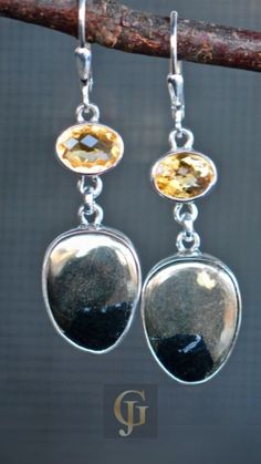 Looking for a special graduation gift for her? Look no further! These gorgeous November birthstone earrings are crafted from sterling silver and feature stunning yellow stones. The perfect way to celebrate her accomplishment and the warm hues of the season. Silver Oval Faceted Earrings, Silver Faceted Oval Earrings, Nickel-free Citrine Dangle Jewelry, Silver Citrine Earrings For Gift, Silver Teardrop Citrine Jewelry, Silver Citrine Drop Earrings Jewelry, Silver Citrine Drop Earrings, Nickel-free Silver Citrine Jewelry, Handmade Silver Citrine Earrings