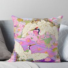 two white birds are flying in the sky on pink and purple background throw pillow cover