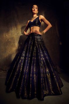 This lush velvet lehenga set features intricate cut work and an antique gold shimmer. The outfit is paired with a net dupatta.From Seema Gujral's Mystique collection. DELIVERY TIMEPlease allow 8-12 weeks for your outfit to arrive. FABRIC DETAILSVelvet, Net. Professional cleaning only. Blue Velvet Lehenga, Navy Blue Lehenga, Seema Gujral, Velvet Lehenga, Blue Lehenga, Navy Blue Velvet, Embroidered Wedding, Wedding Lehenga, Indian Fashion Designers