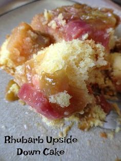 a close up of a piece of cake on a plate with the words rhubarb upside down cake