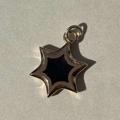 14K solid gold | colored enamel | chain is not included Gold Enamel Tarnish Resistant Jewelry, Rose Gold Enamel Charms Jewelry, Gold Pendant With Black Enamel, Enamel Star Charm Jewelry, Gold Star-shaped Jewelry With Polished Finish, Gold Enamel Star Jewelry, Star-shaped Polished Yellow Gold Jewelry, Polished Star-shaped Yellow Gold Jewelry, Luxury Gold Star Jewelry