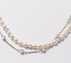 Classic cultured freshwater pearls or sleek sterling silver chain? This double strand necklace gives you a beautiful blend of both looks, combined with polished sterling silver beads to complete the elegant design. From Honora. White Pearl Necklace With Double Chain, Double Strand Silver Pearl Necklace, Silver Double Strand Pearl Necklaces, Silver Dainty Beaded Pearl Necklace, Sterling Silver Beaded Pearl Necklace, Dainty Silver Beaded Pearl Necklace, Silver Double Strand Pearl Chain Necklace, Silver Double Strand Pearl Necklace With Pearl Drop, Silver Double Strand Pearl Necklace Gift