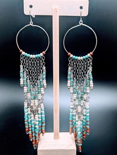 Southwest Style Shoulder Duster Earrings in Turquoise, Cream and Orange on Silver Hoops - Etsy Turquoise Dangling Beaded Earrings, Bohemian Chandelier Earrings With Beaded Chain, Bohemian Turquoise Beaded Chain Earrings, Turquoise Earrings With Beaded Chain, Turquoise Dangle Hoop Earrings With Colorful Beads, Turquoise Earrings With Beaded Chain And Round Beads, Turquoise Bohemian Earrings With Beaded Chain, Bohemian Beaded Chain Dangle Chandelier Earrings, Bohemian Beaded Chandelier Dangle Earrings