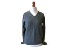 A very nice vintage wool solid grey color sweater. A classic and simple style, excellent for everyday wear. It's light weight knit and warm and soft as it is made of 80% lambs wool . A lovely piece for your wardrobe. This sweater can be worn by woman or men, a unisex design. Materials: 80% lambs wool 20% polyamide Size: women's S, small or mens XS Measurements of it lying flat : length- 64cm/ 25in pit to pit- 52cm/ 20in sleeve- 63cm/ 25in Very good vintage condition. Care- wash as wool, flat dry Classic Gray Soft Knit Sweater, Vintage Gray Winter Sweater, Casual Gray Soft Knit V-neck Sweater, Soft-washed Gray Crew Neck Top, Gray Soft Knit V-neck Sweater, Wool Jackets Women, Simple Sweater, Scandinavian Textiles, Color Sweater