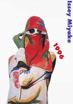 a person wearing a red mask and colorful clothing