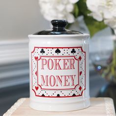 a white coffee mug with the words poker money on it