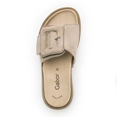 The 43751-12 Slide Sandal in Desert Samtchevreau for Women from Gabor. Elevate your summer style with the Gabor 43751-10 Slide Sandal. Designed for both comfort and elegance, these slide sandals feature a chic taupe hue and a luxurious suede upper. Step into sophistication and shop now for the perfect addition to your warm-weather wardrobe! Material: Suede Heel Height: 10 MM Slide On Shoes, Teacher Shoes, Summer Capsule, Summer Capsule Wardrobe, Summer Sandals, Slide On, Sandal Women, Suede Heels, Sandals Summer