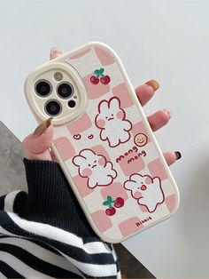 a person holding up a cell phone case with an animal design on the front and back