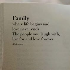 an open book with the words family where life begins and love never ends, the people you laugh with, live for and love forever