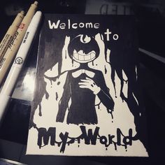 a sign that says welcome to my world with some crayons next to it