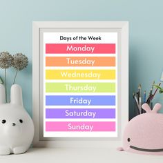 the days of the week printable poster is next to a white vase with flowers