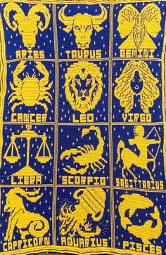 a blue and yellow scarf with zodiac symbols on it