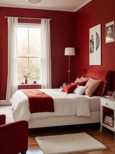 a bedroom with red walls and white bedding, chair, rugs and pictures on the wall