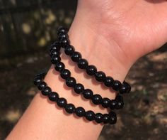 This is an adorable black 8mm beads bracelet. It's stretchy and comfortable and is a perfect go to to match any occasion! Black Beaded Stretch Bracelet, Black Hand-strung Spiritual Stretch Bracelet, Black Stretch Bracelet With 8mm Beads Spiritual Style, Casual Black Beaded Bracelets With Round Beads, Elegant Black Hypoallergenic Beaded Bracelets, Spiritual Black Beaded Stretch Bracelet, Black Beaded Stretch Bracelet For Spiritual Use, Spiritual Black Stretch Bracelet With Black Beads, Black Hypoallergenic Stretch Bracelet With Round Beads