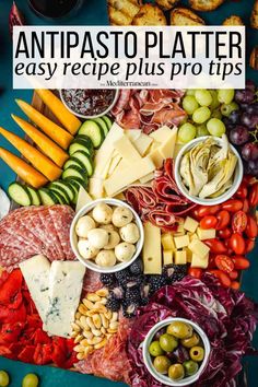 a platter filled with different types of cheeses, meats and olives