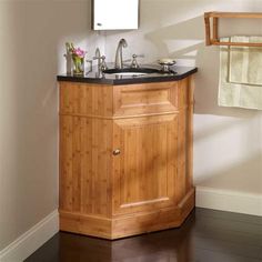 a bathroom with a sink, mirror and towel rack