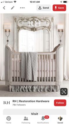 a baby crib in front of a large mirror