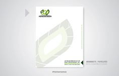 a white brochure with a green leaf on the front and back cover is shown