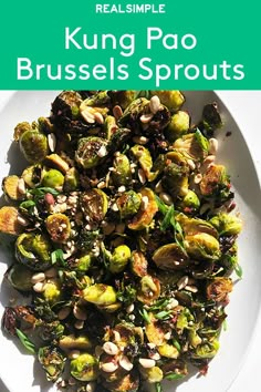 a white plate topped with brussel sprouts and nuts