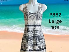 a dress is displayed on a mannequin with the beach in the background and text p882 large 10's