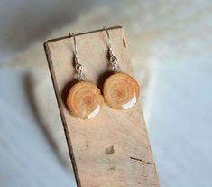 the earrings are made out of wood