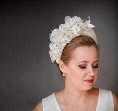 "◆ Large bridal headpiece in ivory inspired by wonderful Kate Middleton. Wide bridal headband is hand made and hand stitched. Bridal flower crown comes with face birdcage veil or without.  ◆ Bridal hairband has been covered in a high quality Italian fabric in a beautiful light ivory and beige colours. Wedding headpiece for bride has been trimmed with light ivory slightly shimmering and non-shimmering flowers and leaves covering the right ear side of the padded headband. Modern and elegant halo c Wedding Halo Headpiece, White Bridal Flowers, Floral Headband Wedding, Flower Headband Wedding, Halo Headpiece, Floral Headpiece Wedding, Bridal Flower Headband, Wedding Halo, Pearl Bridal Headband