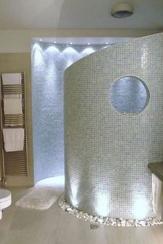 a bathroom with a large round shower in it