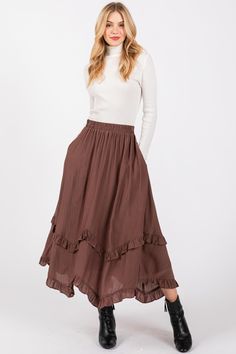 Introducing the Desert Moon Ruffle Detail Flare High Waist Midi Skirt, a beautiful blend of elegance and free-spirited charm. Crafted with a flowy 100% polyester outer layer and a soft 100% rayon lining, this skirt offers both comfort and style, making it perfect for day-to-night wear. The high waist design creates a flattering silhouette, while the ruffle detailing adds a feminine touch and a hint of movement with every step. The flare of the skirt enhances the graceful, breezy feel, making it a versatile piece that pairs effortlessly with anything from casual tops to more dressy blouses. Whether you're exploring the city or heading to a special occasion, the Desert Moon Midi Skirt brings a timeless bohemian flair to your outfit. The lightweight fabric and flowy design ensure you stay com Boho Midi Skirt, Dressy Blouses, Desert Moon, High Waist Midi Skirt, Flowy Design, Candle Room, Dressy Blouse, Skirts Midi High Waisted, Western Boho