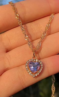 "The cutest little heart charm necklace in a baby pastel purple 𝓓𝓔𝓣𝓐𝓘𝓛𝓢 ♡ 16-18 inch adjustable ♡ 0.5\" cubic zirconium charm ♡ 18k triple gold electroplated chain + color retention ♡ hypoallergenic This necklace makes the perfect gift for yourself or a loved one! 𝓒𝓐𝓡𝓔 𝓘𝓝𝓢𝓣𝓡𝓤𝓒𝓣𝓘𝓞𝓝𝓢 ♡ - Keep your jewelry in a cool, dry environment to ensure the longevity of the product. Plated jewelry can last years with proper care! - Avoid contact with oils, perfumes and other chemicals - Purple Cute Necklaces, Jewelry Heart, Soft Jewelry, Soft Girl Jewelry, Purple Necklaces, Gold And Purple Jewelry, Necklace Purple, Purple Necklace Aesthetic, Purple Pendant