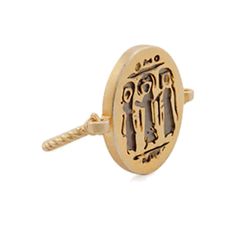 a gold ring with an image of two people on the front and one in the middle