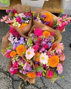 a bunch of flowers that are sitting on the ground