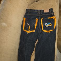 Fuji Denim Jeans With Both Orange Back Pockets And Front Right Orange Pocket With Orange Stitching And Orange Accents And Great Condition No Stains No Tears No Rips Size 32 34 Practically Brand New Never Worn Them. Retro Denim Blue Cotton Jeans, Retro Distressed Cotton Jeans, Orange Denim Bottoms For Spring, Casual Yellow Denim Jeans, Spring Orange Denim Bottoms, Retro Orange Cotton Bottoms, 90s Style Blue Cotton Jeans, Yellow Denim Jeans For Fall, Casual Orange Denim Jeans