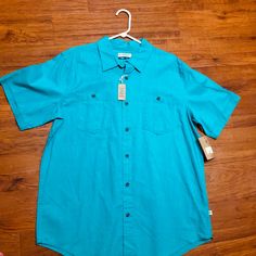 Teal Magellan Button Down. Never Worn Casual Summer Tops With Buttons, Blue Summer Shirt With Snap Buttons, Blue Shirt With Snap Buttons For Summer, Blue Relaxed Fit Shirt With Buttoned Pockets, Casual Blue Shirt With Buttoned Pockets, Fitted Casual Shirt With Buttoned Pockets, Summer Button-up Tops With Functional Buttons, Light Blue Button-up Shirt With Buttons, Blue Short Sleeve Shirt With Buttons