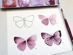 some watercolors are being used to paint different types of butterflies on white paper