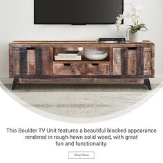 a tv that is on top of a wooden cabinet